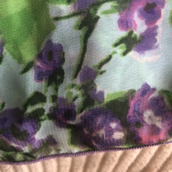 This is a floral jumpsuit with a scarf attached to the top of it on one side. - Picture 6 of 7